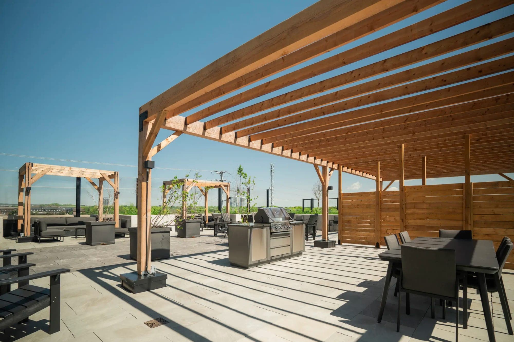 Terrace pergolas with outdoor kitchen and dining.