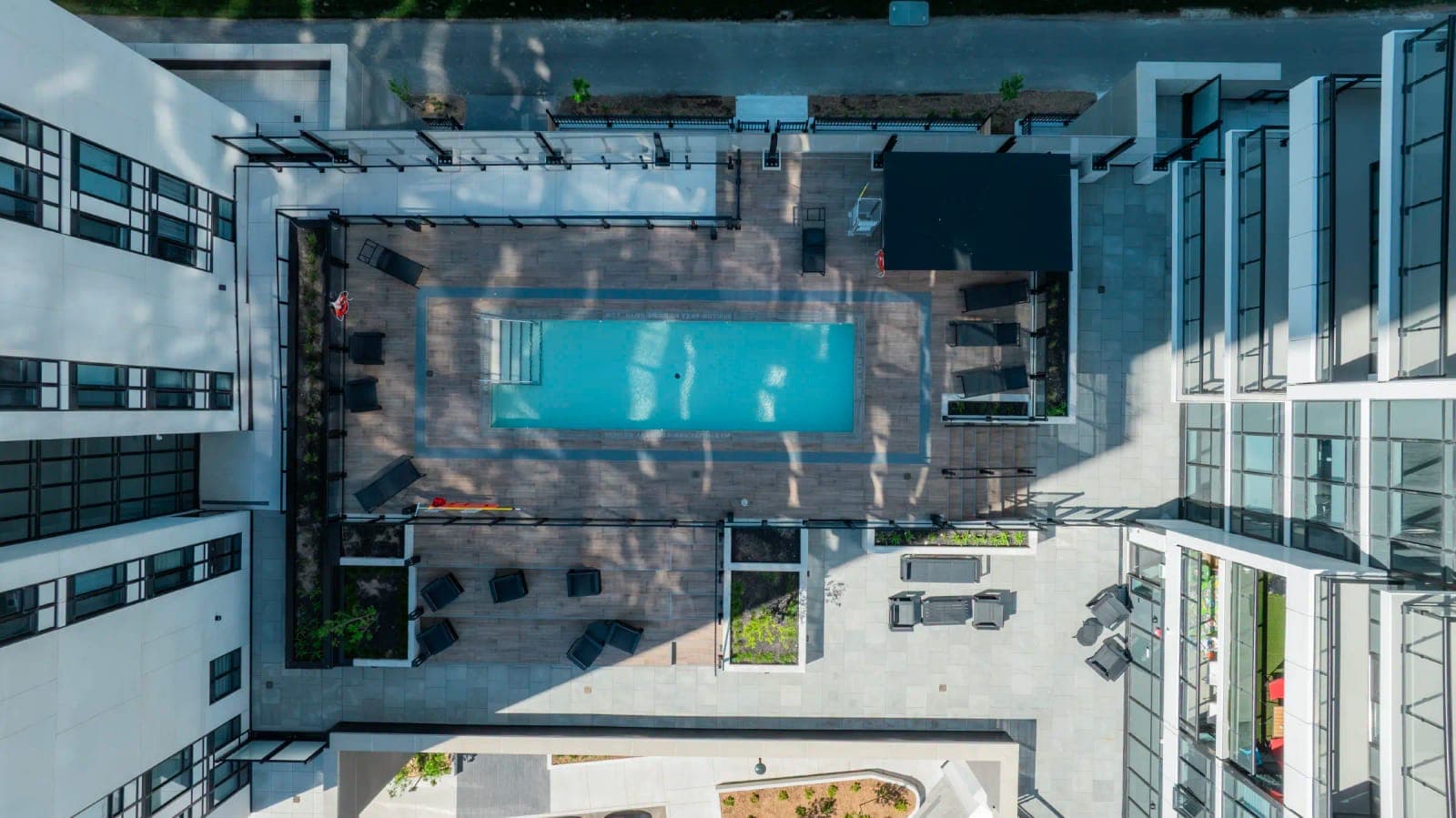 The outdoor pool and sun deck seen from above.